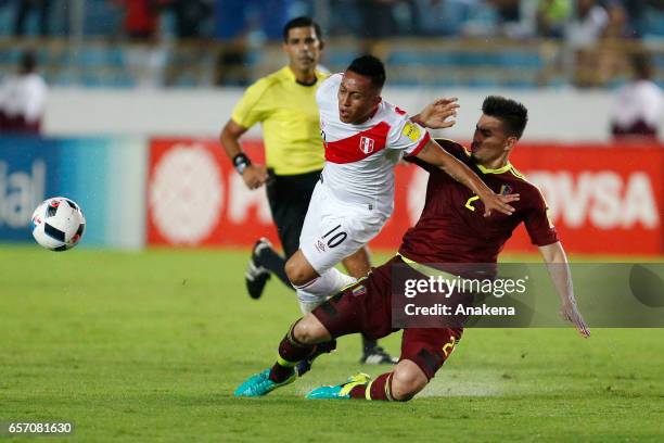 Christian Cueva of Peru and Walker Angel of Venezuela fight for the ball during a match between Venezuela and Peru as part of FIFA 2018 World Cup...