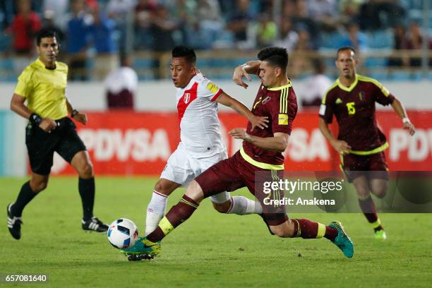 Christian Cueva of Peru and Walker Angel of Venezuela fight for the ball during a match between Venezuela and Peru as part of FIFA 2018 World Cup...