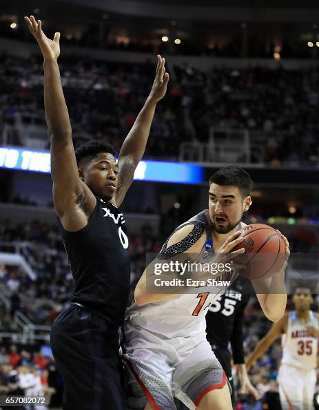 Dusan Ristic Dusan Ristic of the Arizona Wildcats drives against Tyrique Jones of ...