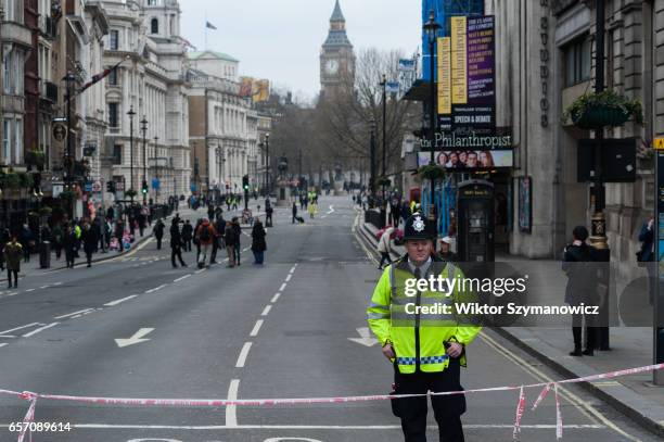Police officer guards Whitehall on a day after a terrorist attack on March 23, 2017 in London, England. PHOTOGRAPH BY Wiktor Szymanowicz /