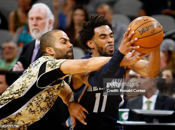 Tony Parker of the San Antonio Spurs tries to make a steal against Mike Conley of the Memphis Grizzlies at AT&T Center on March 23, 2017 in San...