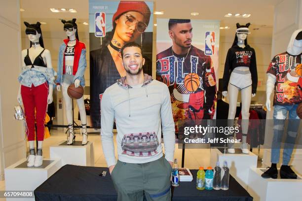Michael Carter-Williams of the Chicago Bulls meets fans at the Forever 21 x NBA Collection Launch Party on March 23, 2017 in Chicago, Illinois.