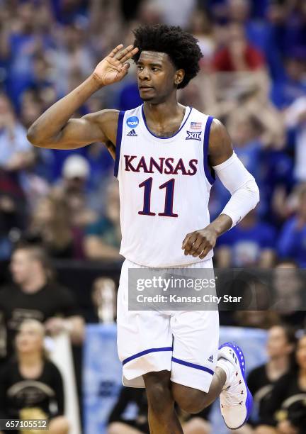 Kansas guard Josh Jackson signals three for his 3-point basket in the first half against Purdue during the Sweet Sixteen round of the NCAA Tournament...