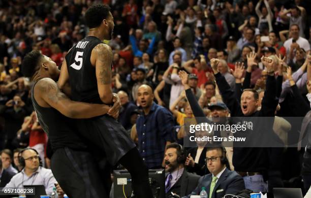 The Xavier Musketeers celebrate their 73 to 71 win over the Arizona Wildcats during the 2017 NCAA Men's Basketball Tournament West Regional at SAP...