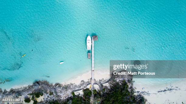 aerial vision, drone capture of the tropical white beaches of long island the bahamas - nassau beach stock pictures, royalty-free photos & images