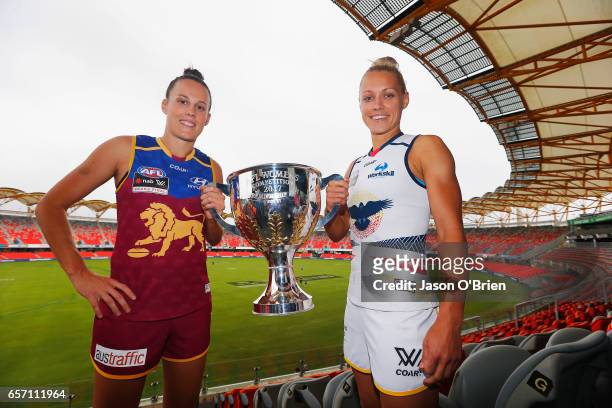 Erin Phillips of the Crows and Emma Zielke of the Lions pose for a photo during the Women's AFL Grand Final press conference at Metricon Stasium on...
