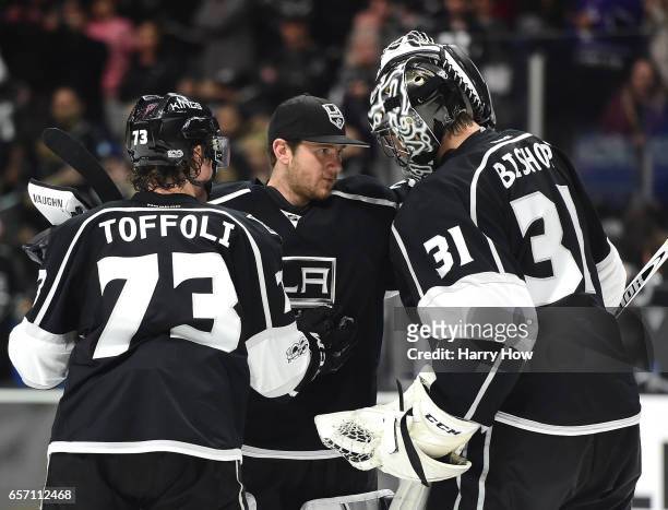 Jonathan Quick of the Los Angeles Kings congratulates Ben Bishop with Tyler Toffoli after a 5-2 Kings win over the Winnipeg Jets at Staples Center on...