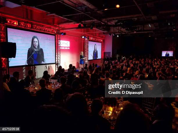 Chelsea Clinton accepts an award on behalf of her father, former US president Bill Clinton, during the GMHC 35th Anniversary Spring Gala at Highline...