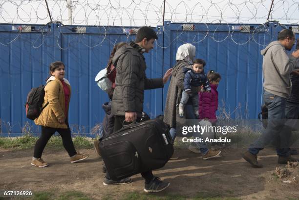 Syrian family waits next to the border gate, after they were selected to claim asylum in Hungary at the Kelebija border crossing , Subotica, Serbia...