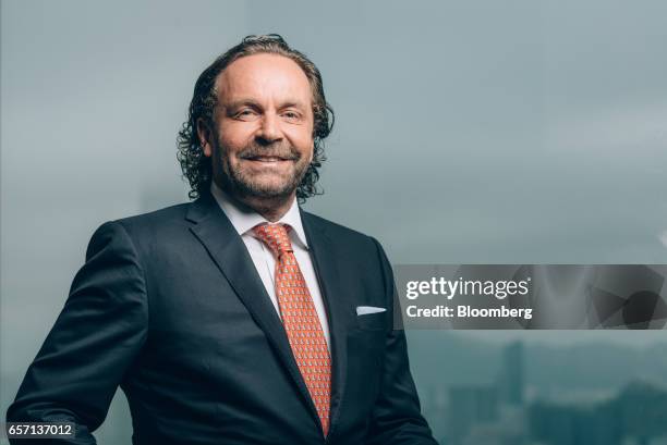 Thomas Flohr, chairman and founder of VistaJet Holding SA, poses for a photograph prior to a Bloomberg Television interview in Hong Kong, China, on...