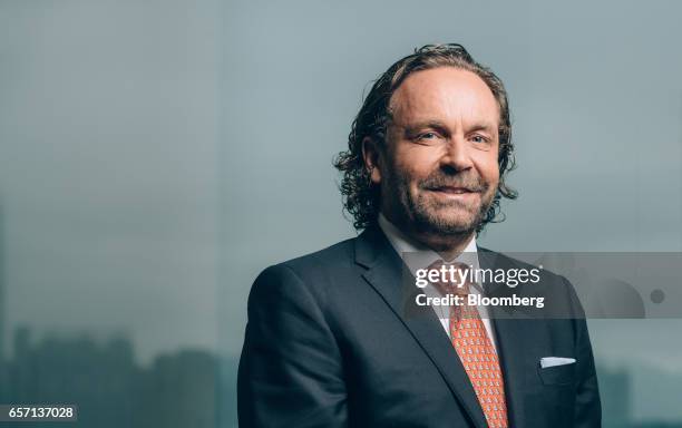 Thomas Flohr, chairman and founder of VistaJet Holding SA, poses for a photograph prior to a Bloomberg Television interview in Hong Kong, China, on...