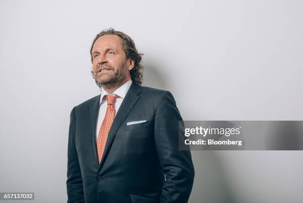 Thomas Flohr, chairman and founder of VistaJet Holding SA, poses for a photograph prior to a Bloomberg Television interview in Hong Kong, China, on...