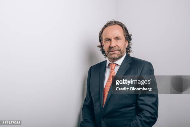 Thomas Flohr, chairman and founder of VistaJet Holding SA, poses for a photograph prior to a Bloomberg Television interview in Hong Kong, China, on...