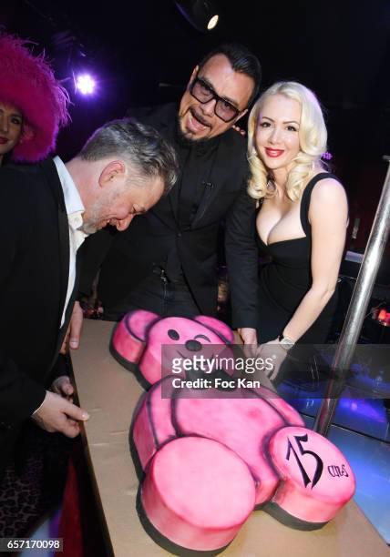 Molieres awarded actor Nicolas Briancon, Muratt Atik and Joanna Atik pose with the birthday cake during Pink Paradise Club 15th Anniversary on March...