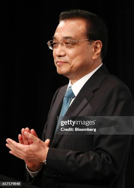 Li Keqiang, China's premier, applauds during the Australia China Economic and Trade Cooperation Forum in Sydney, Australia, on Friday, March 24,...