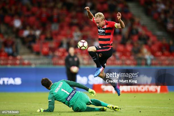 Mitch Nichols of the Wanderers misses an opportunity on goal as he jumps over Melbourne City goalkeeper Thomas Sorensen during the round 24 A-League...