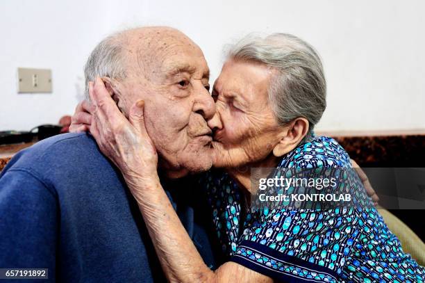 Antonio Vassallo, 100 years-old, and his wife Amina Fedollo pose in their house in Acciaroli, southern Italy. Situated on the western coast of...