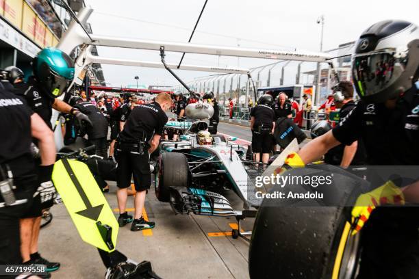 Lewis Hamilton of the United Kingdom driving for Mercedes AMG Petronas enters pit lane as his mechanics change his tyres on Friday Free Practice...