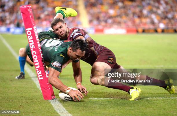 Jordan Rapana of the Raiders scores a try during the round four NRL match between the Brisbane Broncos and the Canberra Raiders at Suncorp Stadium on...