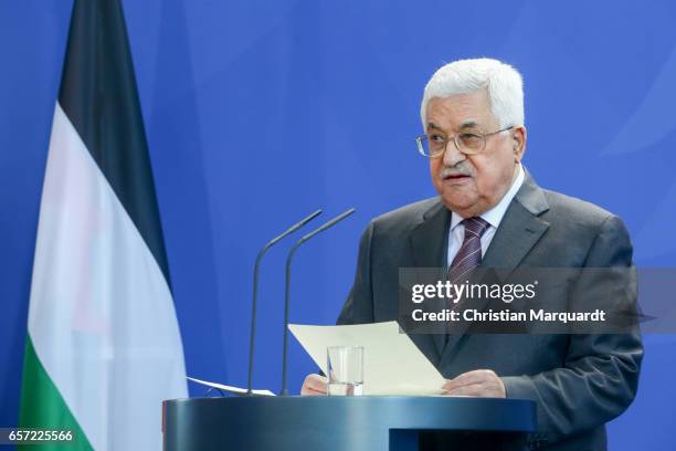 Palestinian President Mahmoud Abbas reacts while speaking to the media with German Chancellor Angela Merkel ahead of a common meeting at the...