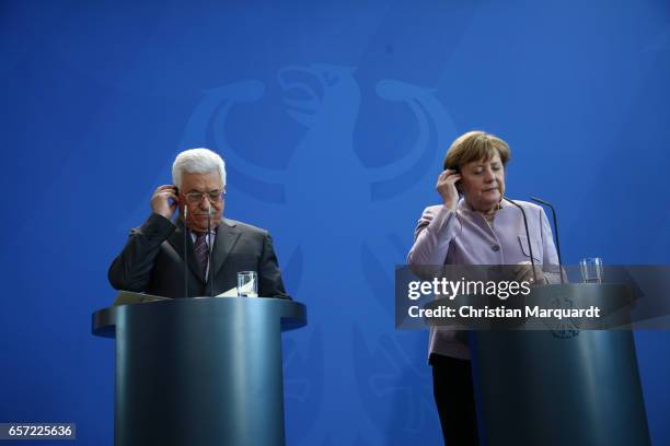 German Chancellor Angela Merkel and Palestinian President Mahmoud Abbas talk to the media ahead of a common meeting at the Chancellory on March 24,...