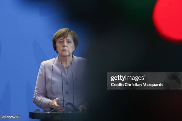 German Chancellor Angela Merkel reacts while speaking to the media with Palestinian President Mahmoud Abbas ahead of their meeting at the Chancellory...