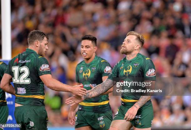 Blake Austin of the Raiders celebrates scoring a try during the round four NRL match between the Brisbane Broncos and the Canberra Raiders at Suncorp...