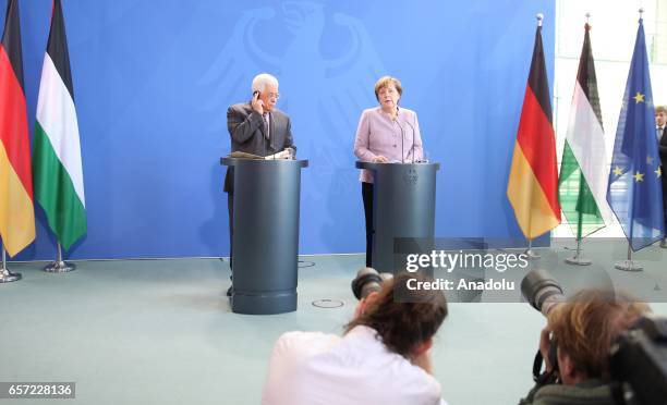 German Chancellor Angela Merkel and Palestinian President Mahmoud Abbas hold a joint press conference before their meeting in Berlin, Germany on...