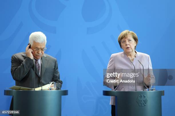 German Chancellor Angela Merkel and Palestinian President Mahmoud Abbas hold a joint press conference before their meeting in Berlin, Germany on...