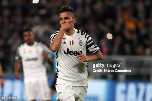 Paulo Dybala of Juventus FC celebrates after scoring the opening goal during the UEFA Champions League Round of 16 second leg match between Juventus...