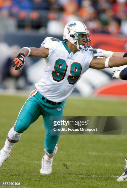 Jason Taylor of the Miami Dolphins in action against the Denver Broncos during an NFL football game December 12, 2004 at Mile High Stadium in Denver,...