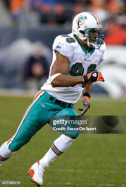 Jason Taylor of the Miami Dolphins in action against the Denver Broncos during an NFL football game December 12, 2004 at Mile High Stadium in Denver,...