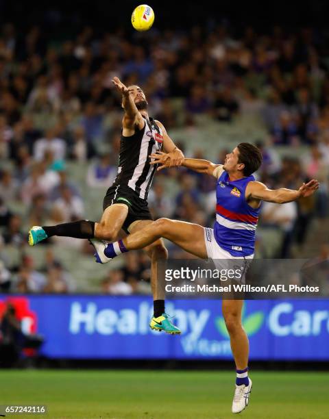 Brodie Grundy of the Magpies and Tom Boyd of the Bulldogs compete in a ruck contest during the 2017 AFL round 01 match between the Collingwood...