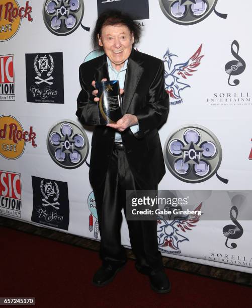 Comedian/actor Marty Allen, recipient of the Lifetime Achievement: Comedian award, poses with his trophy during the inaugural Las Vegas F.A.M.E...