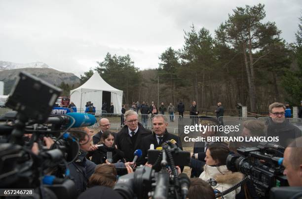 Luftansa CEO Carsten Spohr and Germanwings former CEO Thomas Winkelmann speak to journalists during the commemoration ceremonies at the Vernet...