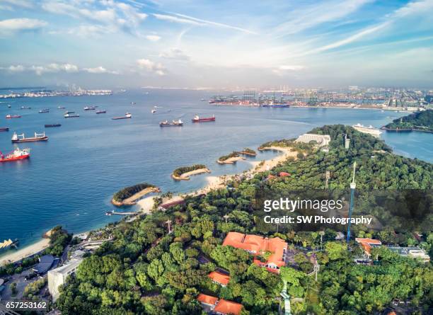drone view of the sentosa island of singapore - sentosa island singapore stock pictures, royalty-free photos & images