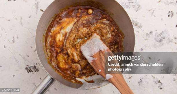 creamed coconut and curry paste. - stirring stock pictures, royalty-free photos & images
