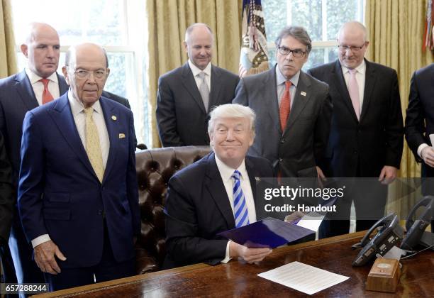 President Donald Trump speaks during a National Economic Council meeting in the Oval Office at the White House March 24, 2017 in Washington, DC.