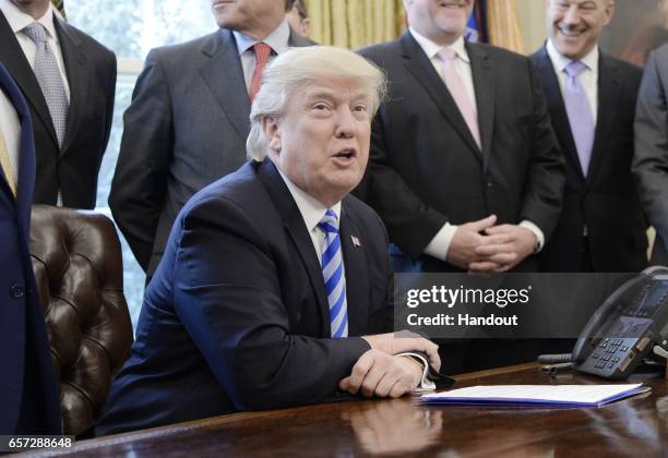 President Donald Trump speaks during a National Economic Council meeting in the Oval Office at the White House March 24, 2017 in Washington, DC.