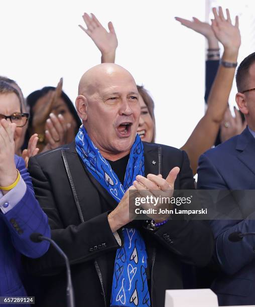 Carmen Marc Valvo, fashion designer along with the Colon Cancer Alliance ring the Nasdaq Stock Market opening bell at NASDAQ MarketSite on March 24,...