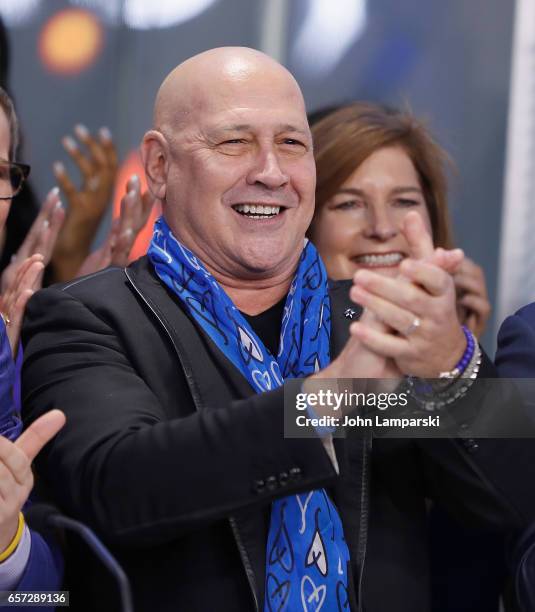 Carmen Marc Valvo, fashion designer along with the Colon Cancer Alliance ring the Nasdaq Stock Market opening bell at NASDAQ MarketSite on March 24,...