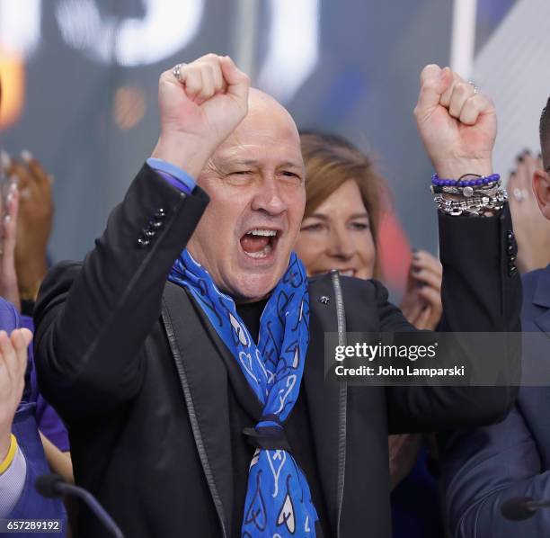 Carmen Marc Valvo, fashion designer along with the Colon Cancer Alliance ring the Nasdaq Stock Market opening bell at NASDAQ MarketSite on March 24,...