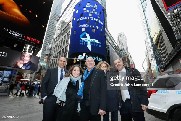 Carmen Marc Valvo, fashion designer along with the Michael Mission foundation ring the Nasdaq Stock Market opening bell at NASDAQ MarketSite on March...