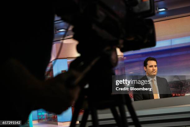 Jim Keenan, head of global credit of BlackRock Financial Management Inc., listens during a Bloomberg Television interview in New York, U.S., on...