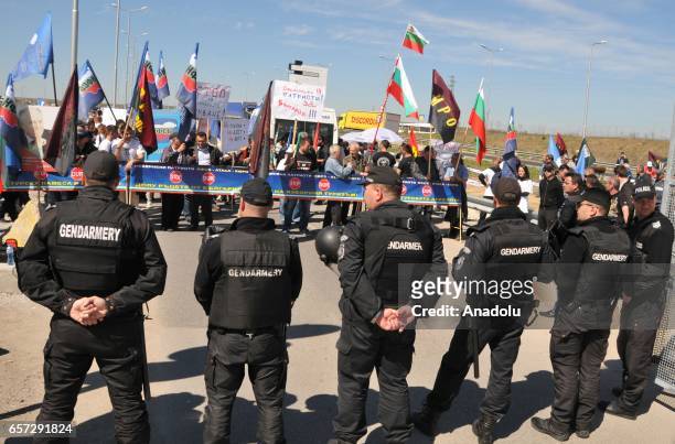 Bulgarian security forces take security measures and block the passage of vehicles during a protest by Bulgarian nationalist groups at the Kapitan...