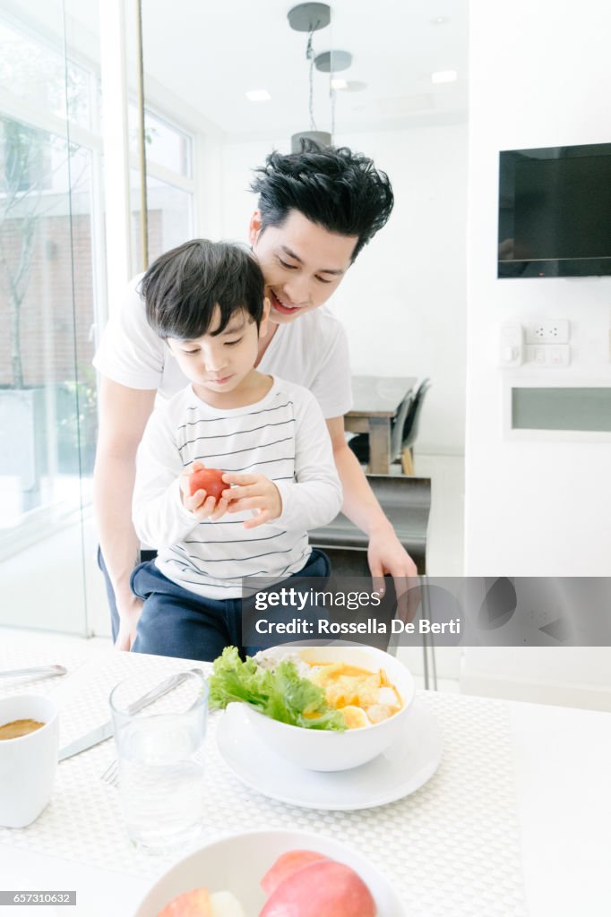 Father and son breakfast in the kitchen