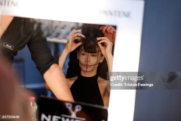 Model being styled backstage ahead of the Murat Aytulum show during Mercedes-Benz Istanbul Fashion Week March 2017 at Grand Pera on March 24, 2017 in...