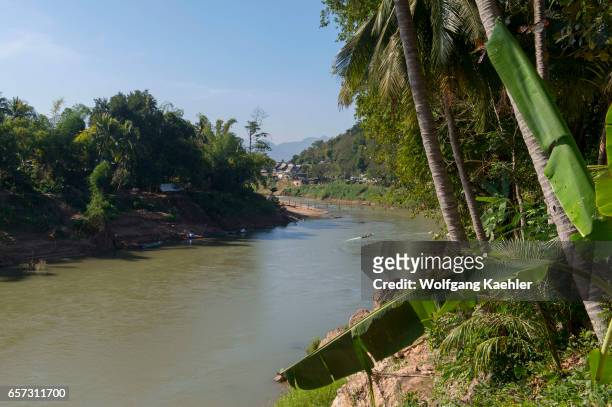 View of a bamboo bridge over the Nam Khan River in Luang Prabang in Central Laos.