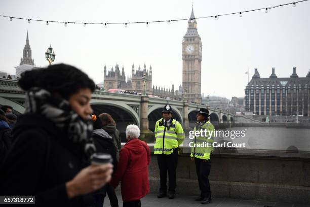 Police officers patrol on the South Bank on March 24, 2017 in London, England. A fourth person has died after Khalid Masood drove a car into...