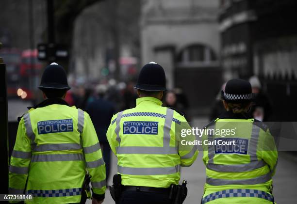 Police officers patrol Whitehall on March 24, 2017 in London, England. A fourth person has died after Khalid Masood drove a car into pedestrians on...